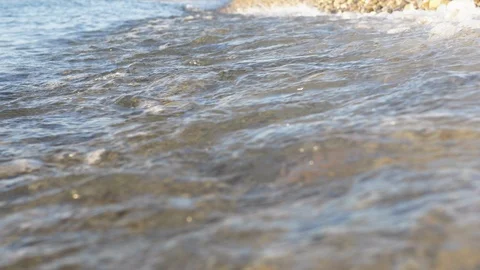 Sea view on the Nice seashore with pebble in summer day. Sea waves surface close Stock Footage 112775857