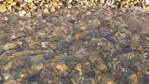 Sea view on the Nice seashore with pebble in summer day. Sea waves surface close Stock Footage 112777774