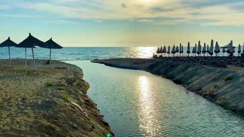 Sea view. A small river flows into the sea. Stock Footage 245882777
