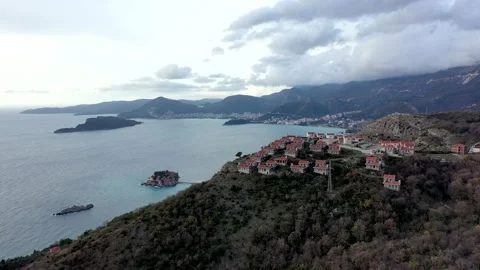 Sea view from small village with orange roofs on high mountain range Stock Footage 150840604