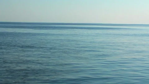 Sea view with small waves, blue water, sea horizon, coast. Transparent waves Stock Footage 169882525