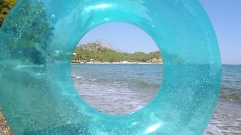 Sea view through the inflatable ring 스톡 동영상 124584188