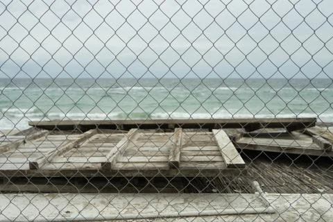 Sea view through the netting Stock Photos