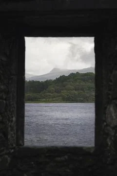 Sea view through a rocky window of Kilchurn Castle, Scotland Stock Photos