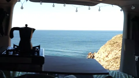 Sea views from a camper van with a coffee maker Stock Footage 276484167