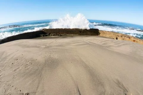 Sea wall blocking wave Stock Photos