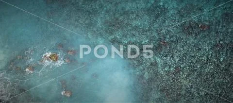 Sea water and beach at Nusa Penida island at the Kelingking cliff Stock Photos