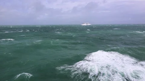 Sea Water Surface With A Ferry Sailing By In Windy Weather Stock Footage 307653553