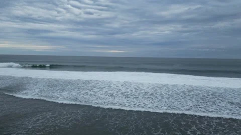 Sea water waves under a cloudy sky, calm atmosphere, ocean Stock Footage 318111331