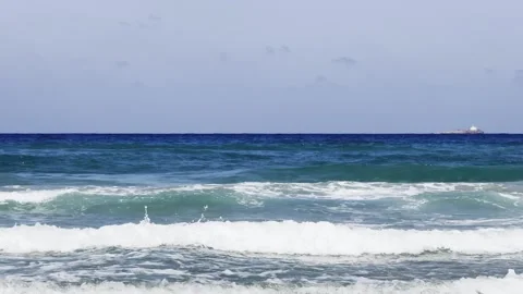 Sea water is wrapped in waves forming white foam. Beautiful background of sea. Stock-Footage 343544019