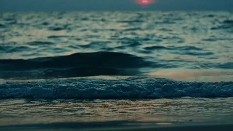 A sea wave on the background of sunset Stock Footage 264942426