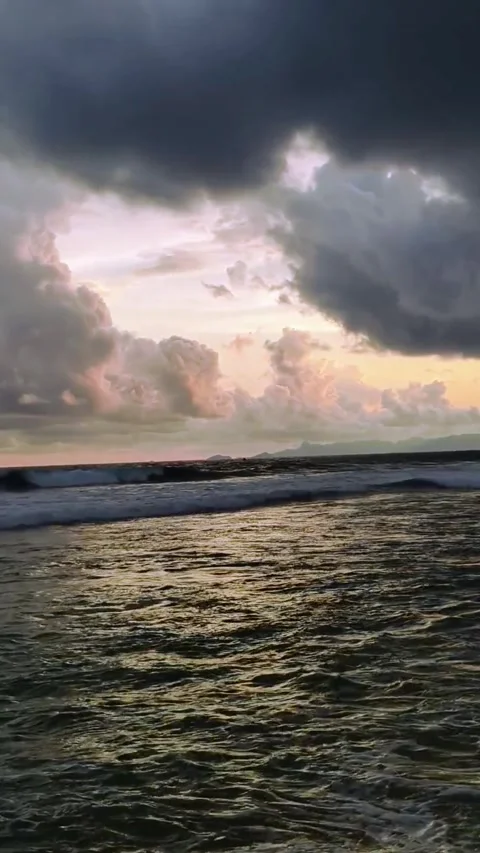 Sea wave on the beach at sunset time Kedung tumpang beach in Tulungagung, E.. Stock Footage 310010455