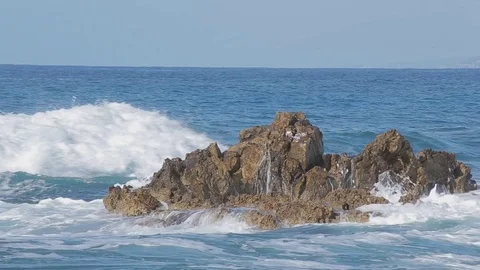 Sea wave beats on a big stone. Sunny day Stock-Footage 74968062