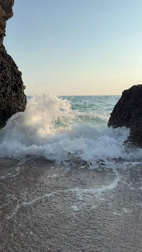 Sea wave between coastal rocks at Agios Gordios beach on Corfu Island, Greece. T Video stock 344426619