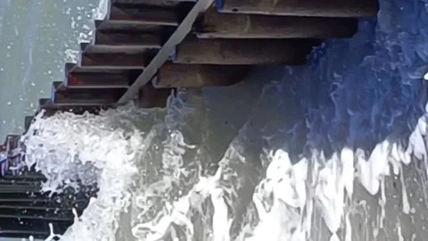 Sea wave breaking on a breakwater Stock Footage 233498714
