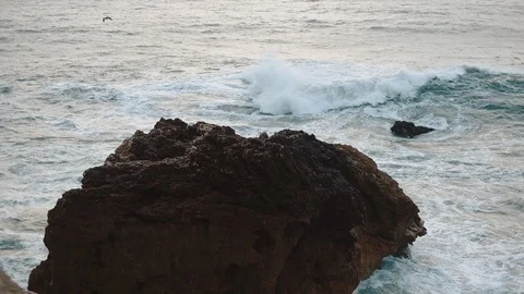 Sea Wave Breaks On Beach Rocks Landscape. Sea Waves Crash And Splash On Rocks. Stock Footage 107554280