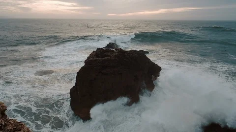 Sea Wave Breaks On Beach Rocks Landscape. Sea Waves Crash And Splash On Rocks. Stock-Footage 107554840