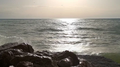 Sea wave breaks on the rocks 4K Stock Footage 126935979