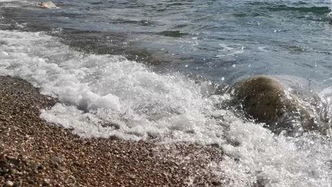 A sea wave breaks on the shore Stock Footage 131182147