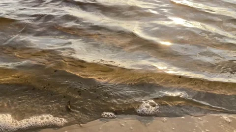 Sea wave close up, low angle view, sunrsie shot Stock Footage 235620172