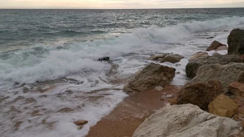 Sea wave close-up rolls on the sandy beach. Stock Footage 152277134
