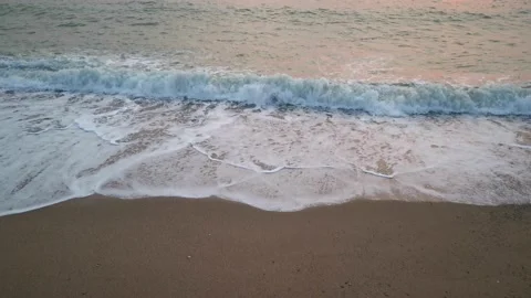 Sea wave close-up rolls on the sandy beach Stock-Footage 161020402