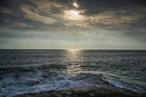 Sea wave close up at sunset Stock Photos