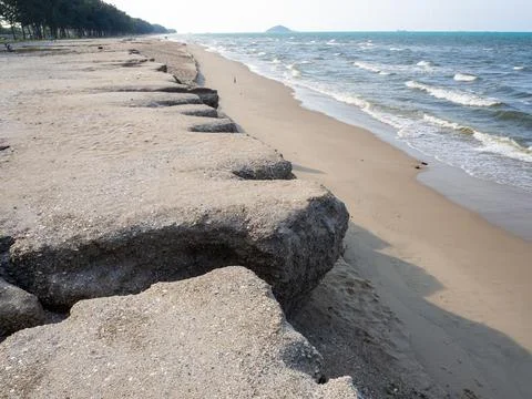Sea wave eroding a sandy beach. Beach eroded gulf of Thailand. Chalathat beac Stock Photos