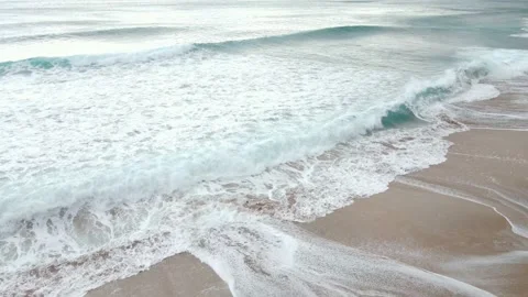 Sea wave with foam and sandy shore, summer background. Stock Footage 232444271