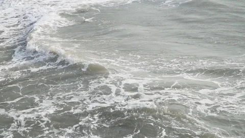 Sea wave hitting rocks beach summer stone evening sunset above view slow motion Video stock 108330623