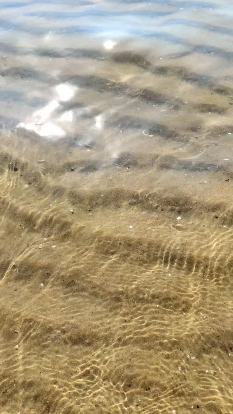 Sea wave rolls onto sandy shore. Sea coast. Seascape of nature. Stock Footage 327902402