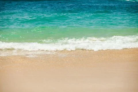 Sea wave to the sandy beach Stock Photos
