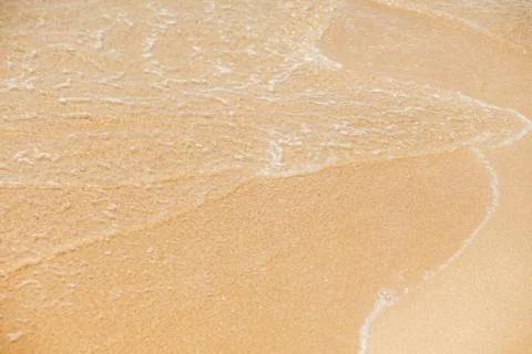 Sea wave to the sandy beach Stock Photos