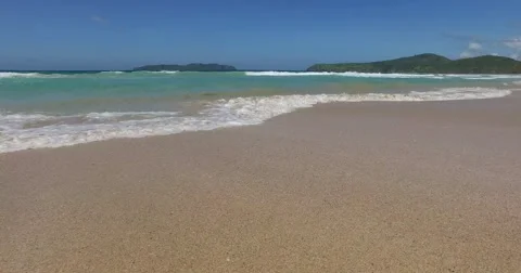 Sea wave on a sandy beach a summer day Stock Footage 61168699