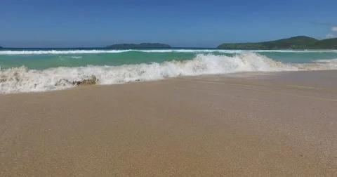 Sea wave on a sandy beach a summer day Stock Footage 61168774