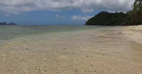 Sea wave on a sandy beach a summer day Stock Footage 61237340