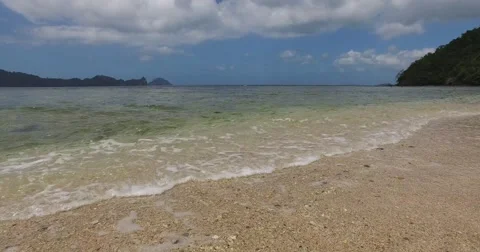 Sea wave on a sandy beach a summer day Stock Footage 68763839