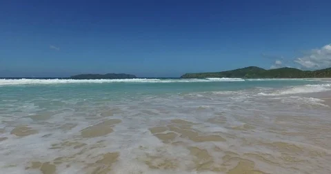 Sea wave on a sandy beach a summer day Stock Footage 70064864