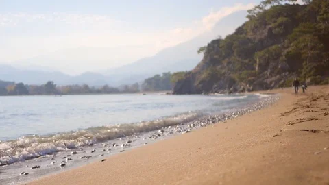 Sea wave splash on sandy beach in autumn day Stock Footage 85837114