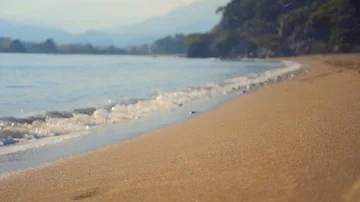 Sea wave splash on sandy beach in autumn day Stock Footage 85837482