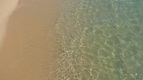 Sea wave splashing on brown sand of the beach Stock Footage 149655152