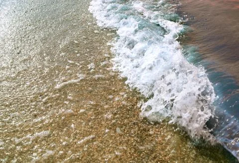 Sea wave at sunset Stock Photos