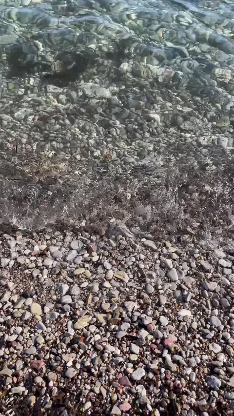 Sea wave washing pebble sandy beach, background with blank copy space for text Stock Footage 337404031
