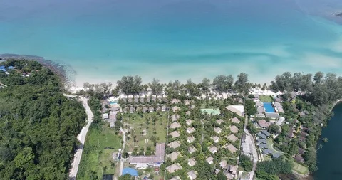 Sea wave on white sand beach with resort hotel island aerial view Stock Footage 104313866