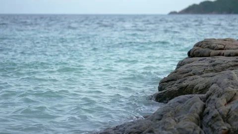 Sea waves against rocks in the beach. Stock Footage 229355546
