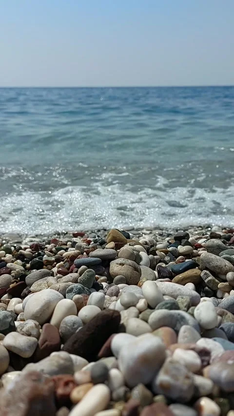 Sea waves and pebbles on the beach Stock Footage 244789410