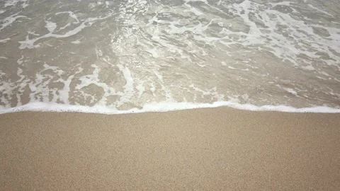 Sea waves and sandy beach during sunny morning Stock Footage 132042289