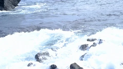 Sea waves and volcanic rocks close-up, natural background. Stock Footage 233665584