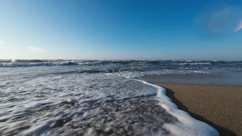 Sea waves approach the camera. Summertime slow motion shooting Stock Footage 276710339