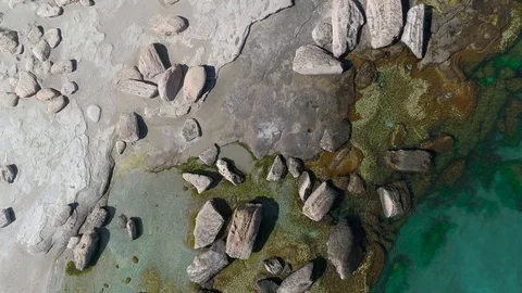 The sea waves are beating against the stones. 動画素材 94229468